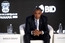 Obama listens to his fellow speakers deliver remarks to business leaders at the CEO Summit of the Americas in Panama City, Panama