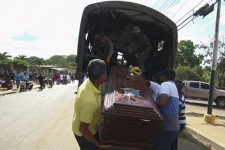 Relatives of a dead miner, carry out a coffin from a military truck during a tribute prior to their burial in Tumeremo in Bolivar state, Venezuela March 16, 2016. REUTERS/Stringer FOR EDITORIAL USE ONLY. NO RESALES. NO ARCHIVE.