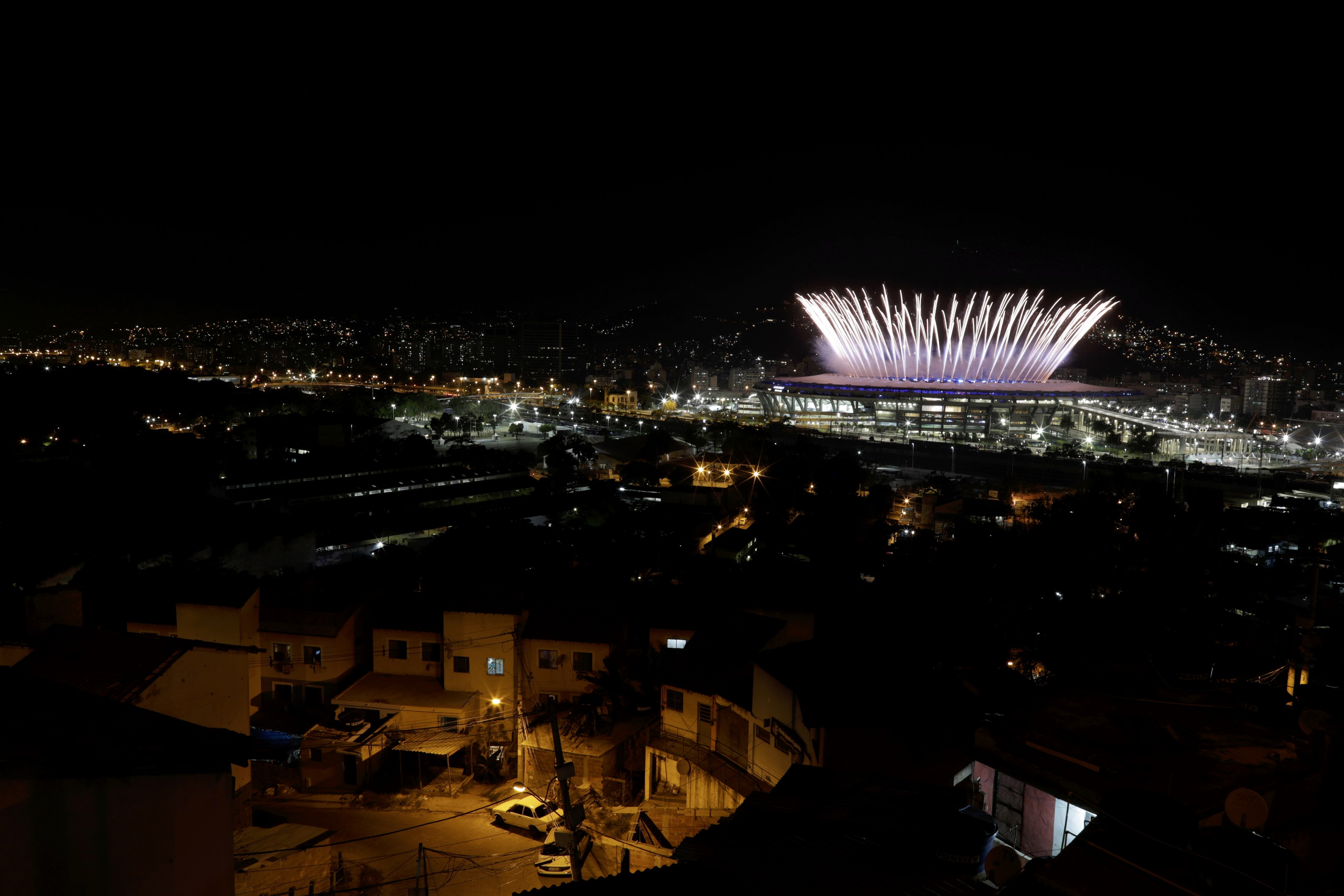 2016 Rio Olympics - Opening Ceremony - Maracana - Rio de Janeiro, Brazil - 05/08/2016. The Maracana Olympic Stadium during the opening ceremony is seen from the Mangueira favela slum. REUTERS/Ricardo Moraes TPX IMAGES OF THE DAY FOR EDITORIAL USE ONLY. NOT FOR SALE FOR MARKETING OR ADVERTISING CAMPAIGNS.