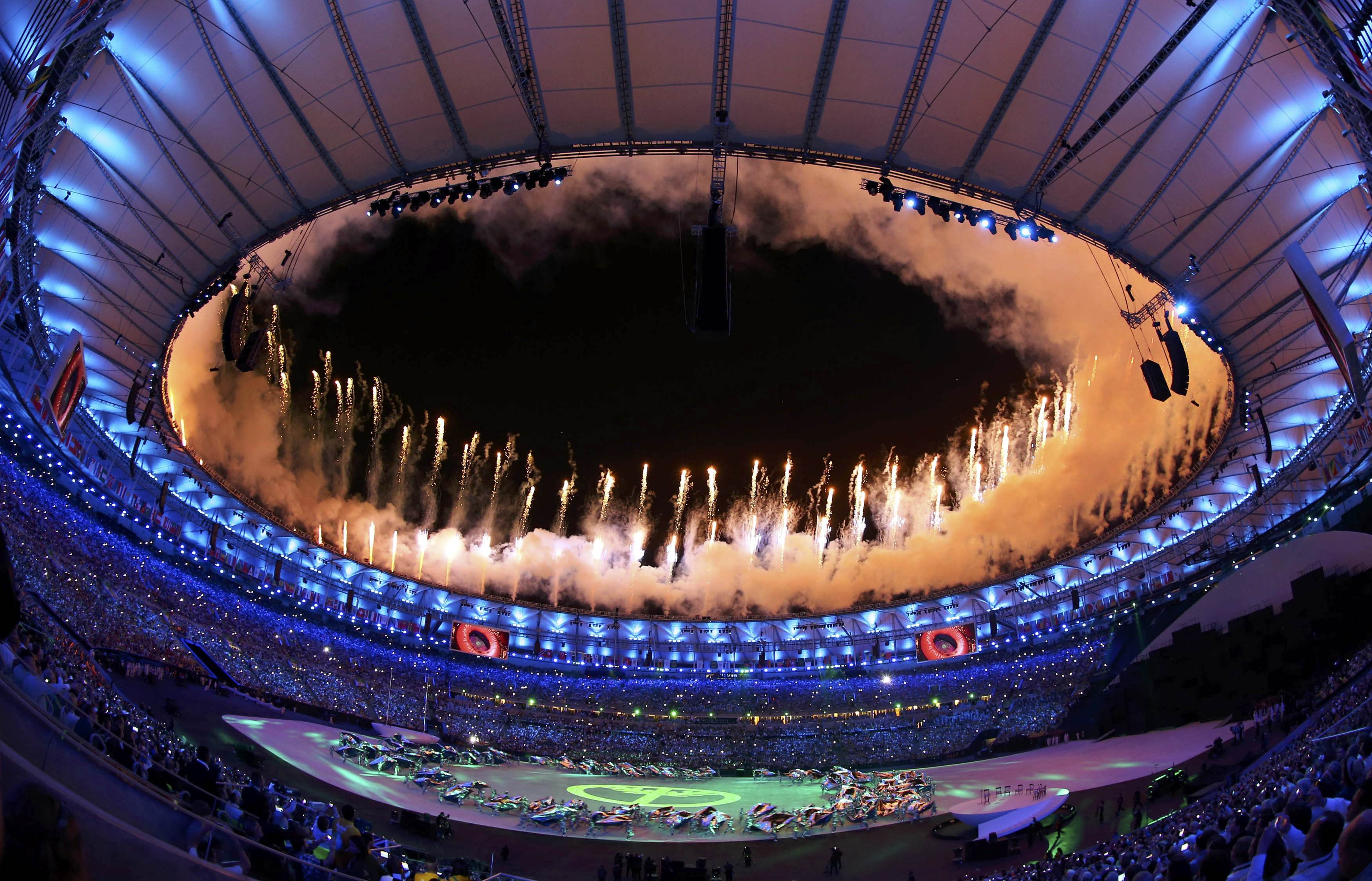 2016 Rio Olympics - Opening ceremony - Maracana - Rio de Janeiro, Brazil - 05/08/2016. Fireworks explode during the opening ceremony. Picture taken with a fisheye lens REUTERS/Ivan Alvarado FOR EDITORIAL USE ONLY. NOT FOR SALE FOR MARKETING OR ADVERTISING CAMPAIGNS
