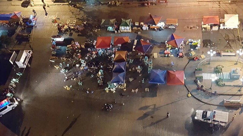 A photo taken from a mobile phone shows a general view of the site of an explosion at a night market in Davao City, in southern island of Mindanao, on late September 2, 2016. At least 10 people died and dozens were injured when an explosion rocked Philippine President Rodrigo Duterte's home city of Davao on September 2, 2016 night, police told AFP. The explosion occurred in a bustling part of the city and close to one of its top hotels that is popular with tourists and business people, city spokeswoman Catherine dela Rey said. / / AFP PHOTO / STRINGER